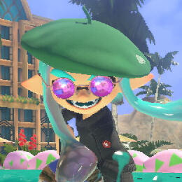 An image of an Inkling from the video game Splatoon 3. He has two long, hairlike tentacles and is wearing a green beret, purple sunglasses, and a black turtleneck. He smiles somewhat deviously as he runs towards the viewer.